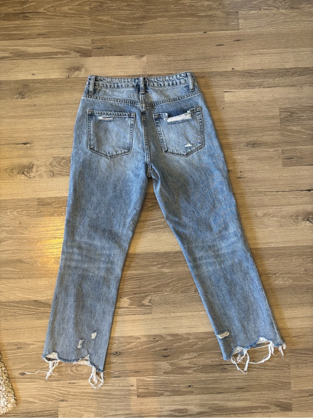 Women's Distressed High-Rise Cropped Jeans in Light Blue - Picture 2 of 3